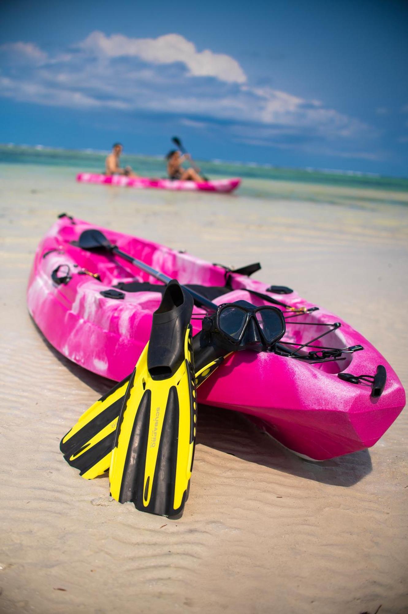 Diamonds Leisure Beach & Golf Resort Diani Beach Bagian luar foto A sit-on-top kayak with a pair of flippers
