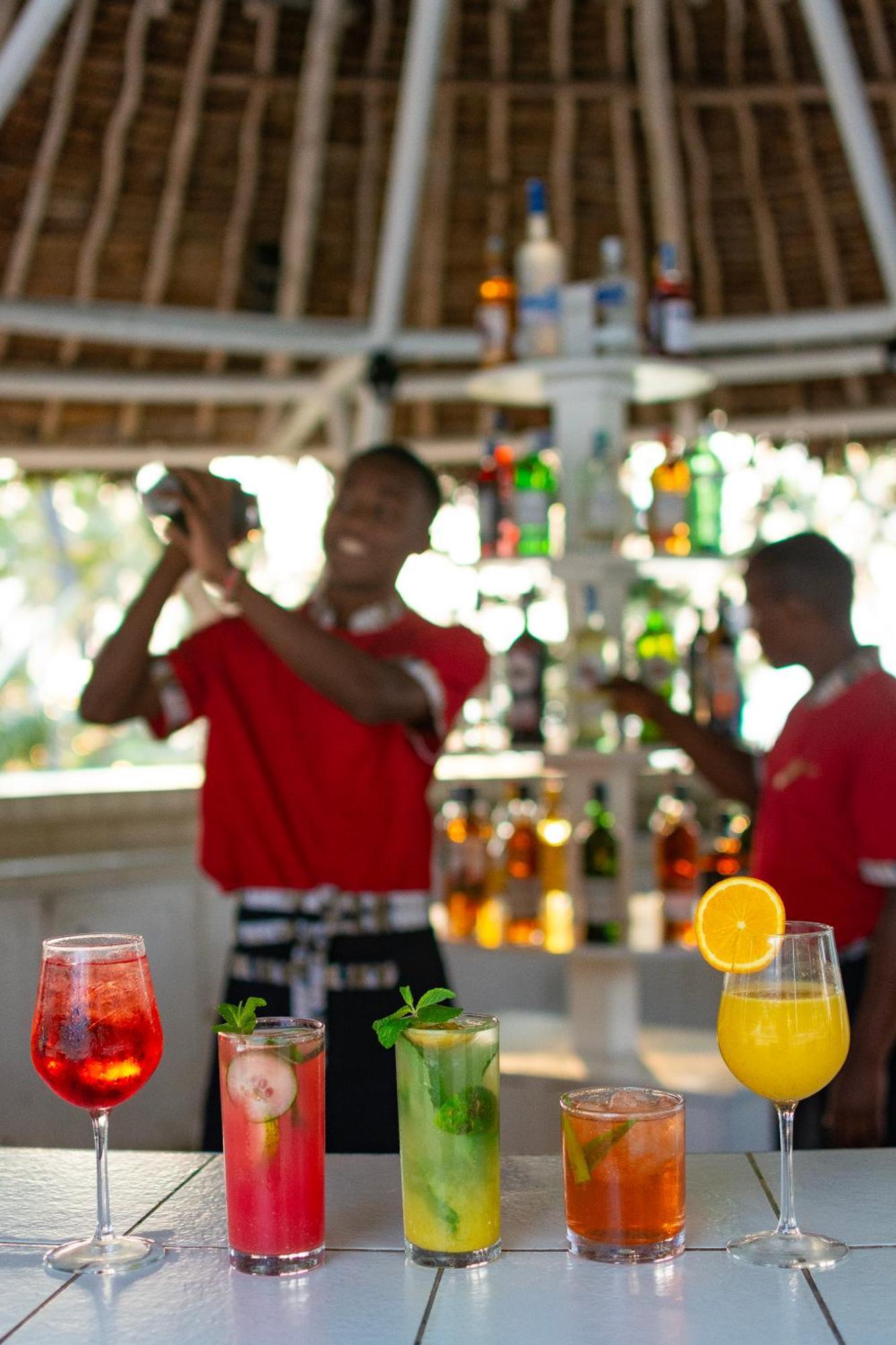 Diamonds Leisure Beach & Golf Resort Diani Beach Bagian luar foto Bartenders at work
