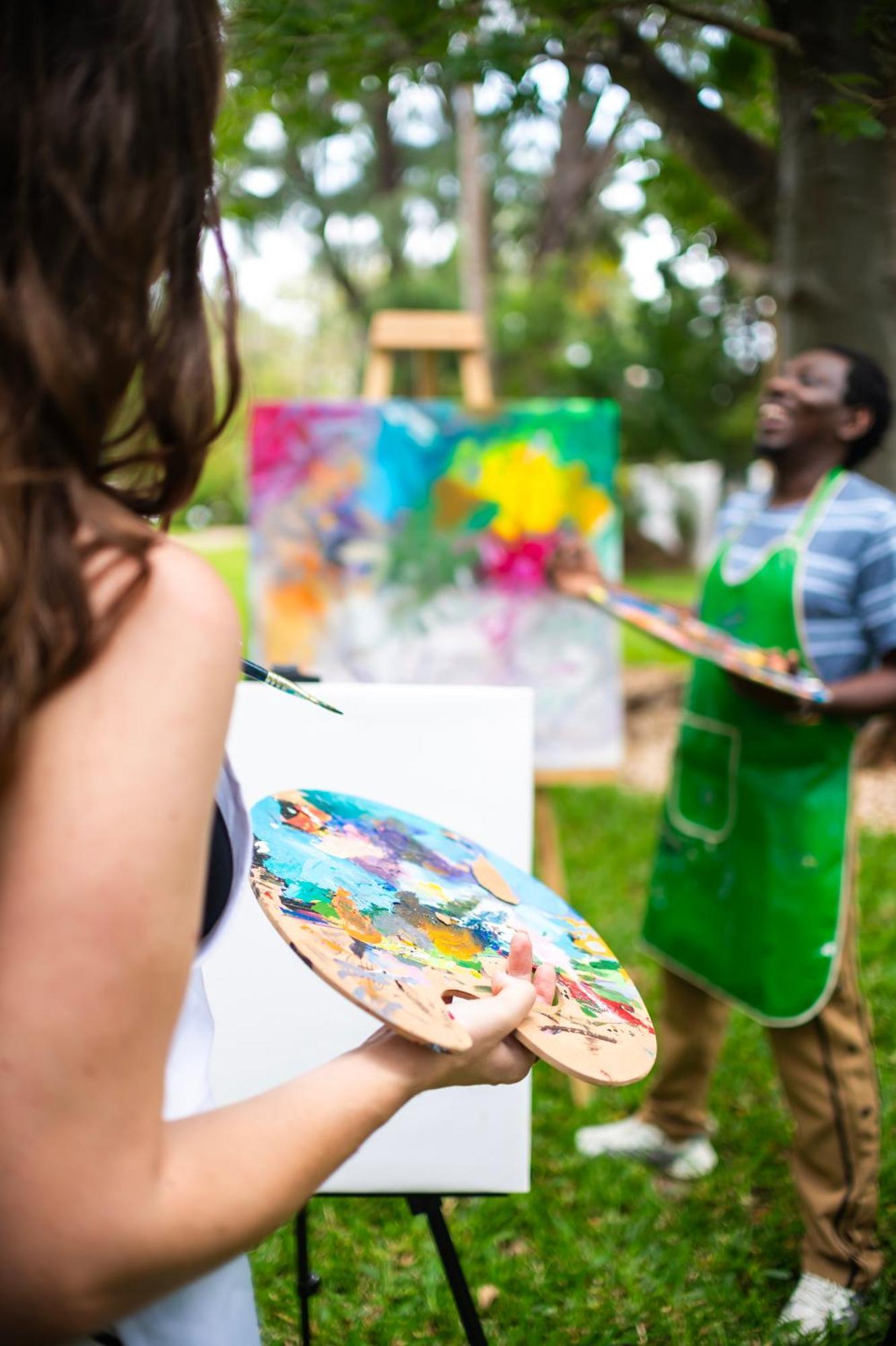 Diamonds Leisure Beach & Golf Resort Diani Beach Bagian luar foto A painter working on a canvas
