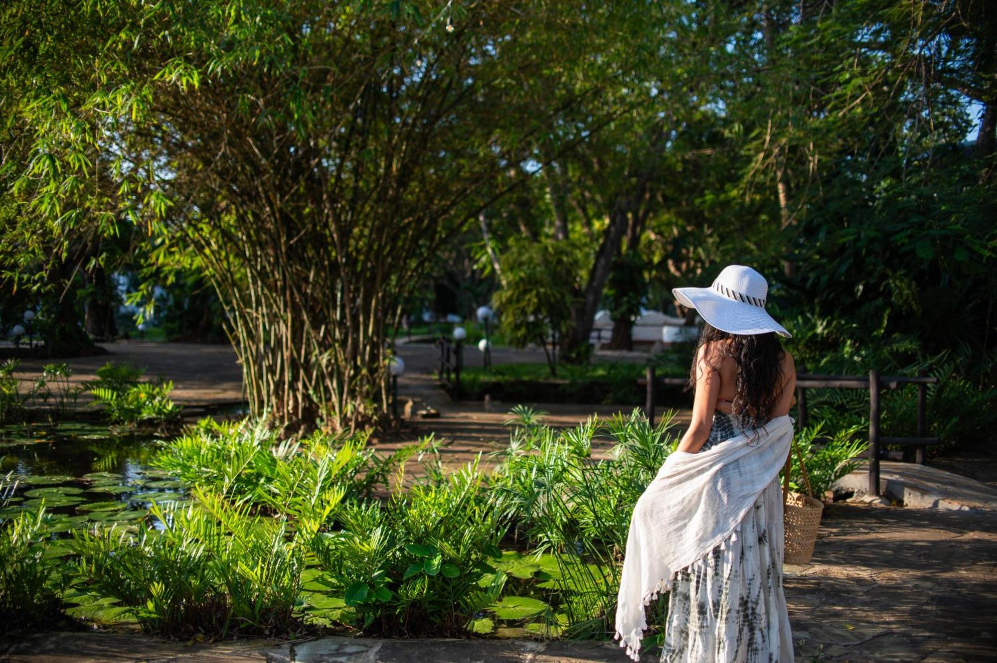 Diamonds Leisure Beach & Golf Resort Diani Beach Bagian luar foto A woman in the park
