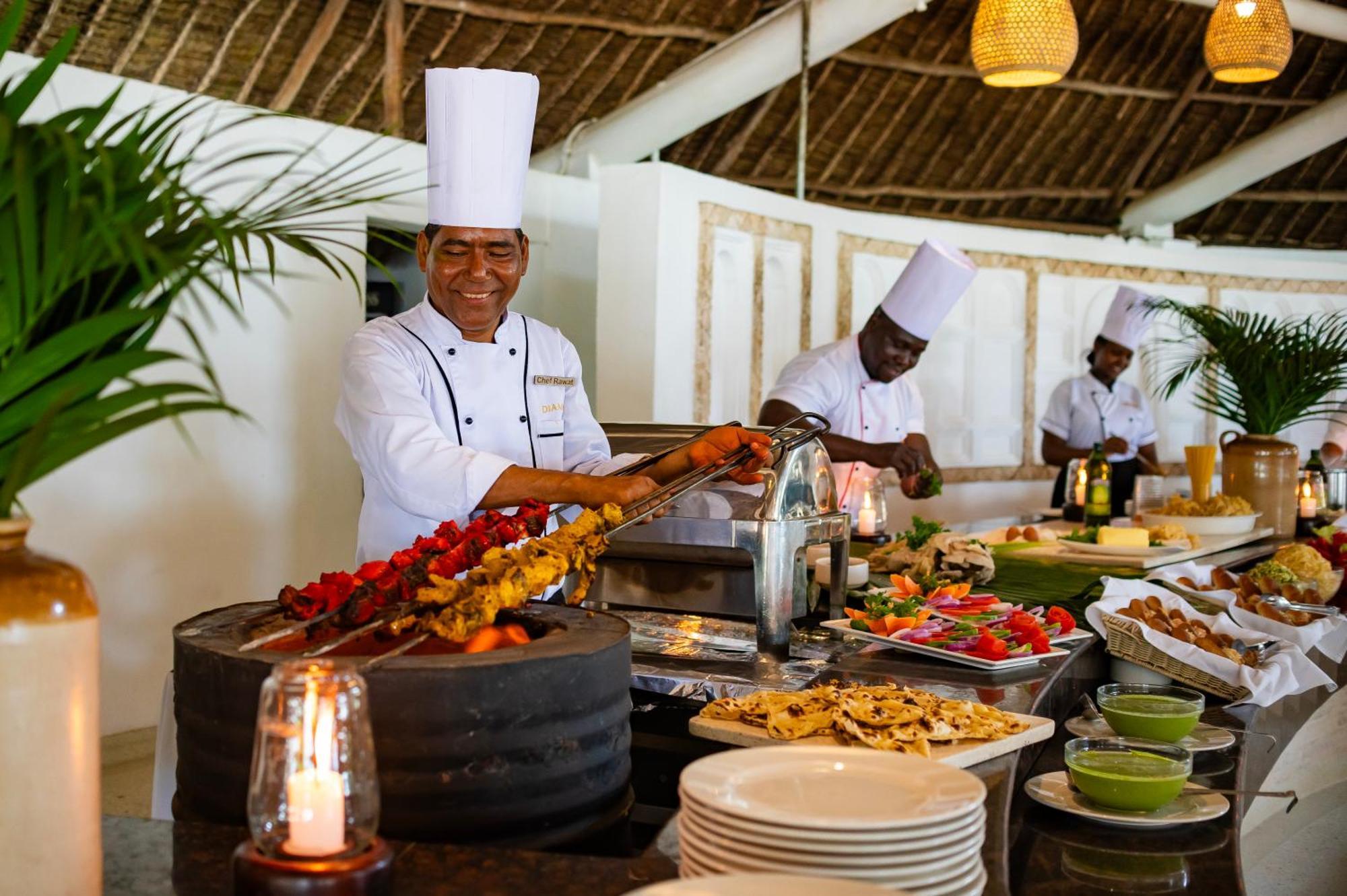 Diamonds Leisure Beach & Golf Resort Diani Beach Bagian luar foto A buffet at a resort